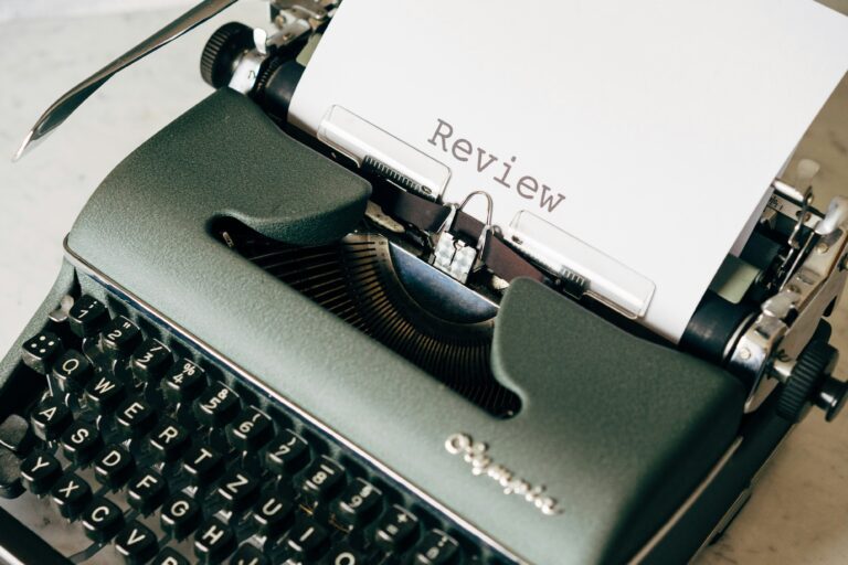 Review spelled out on typewriter.